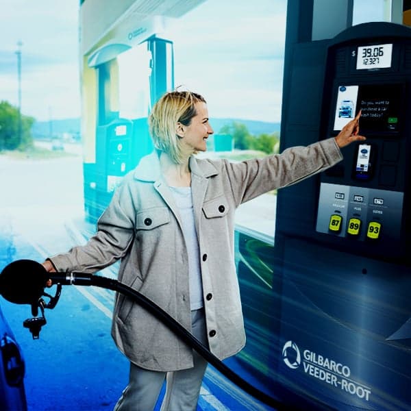 Woman fueling at a fuel station