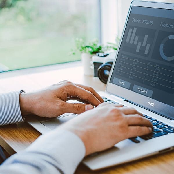 Person remotely managing their forecourt